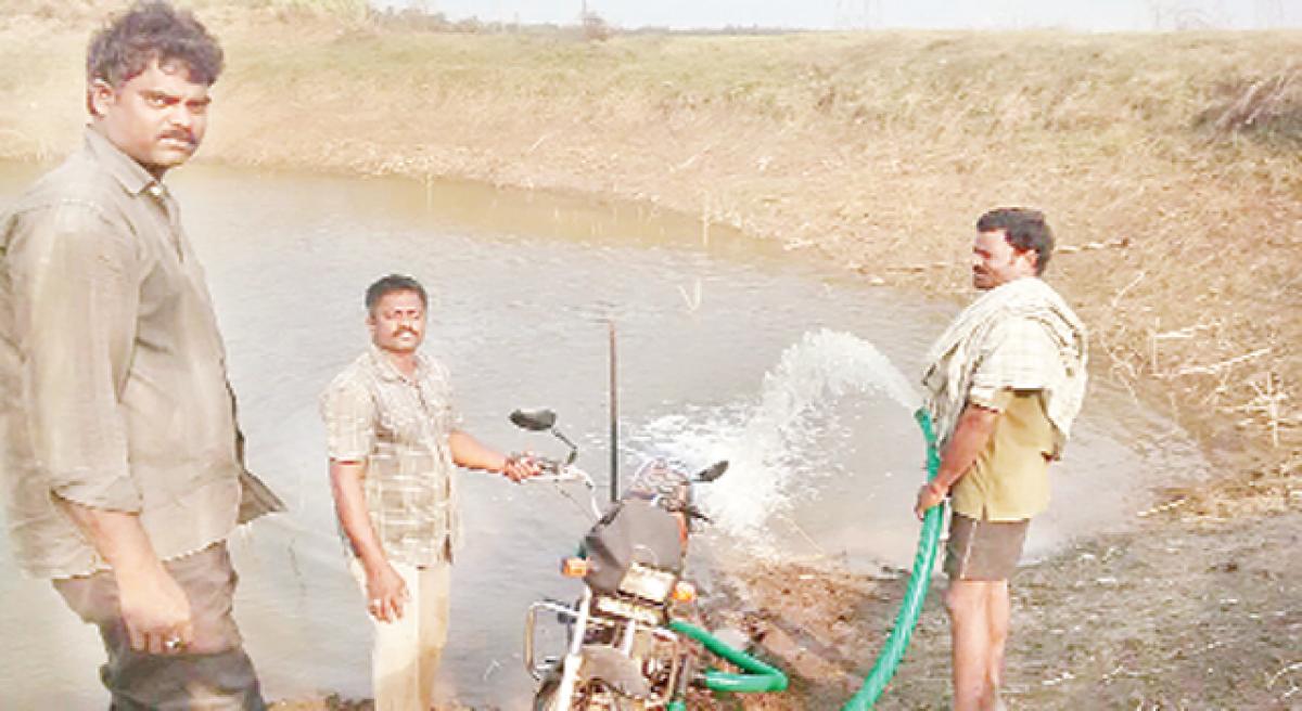 Farmer uses bike motor to irrigate crops