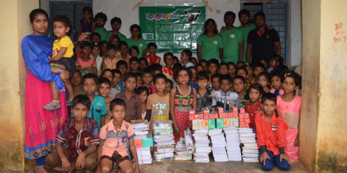 NGO distributes note books to tribal students