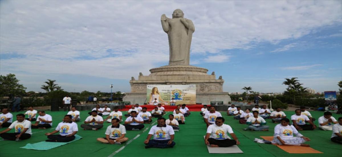 Tourism officials celebrate Yoga Day at Buddha Statue