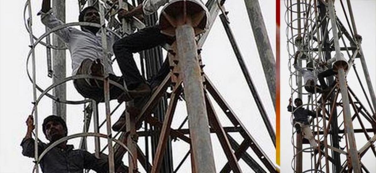 Five farmers climb cellphone tower in Nalgonda as a form of protest