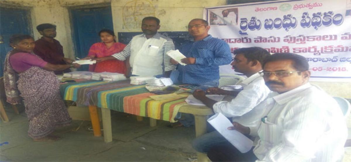 Cheques, pass books distributed in Vikarabad