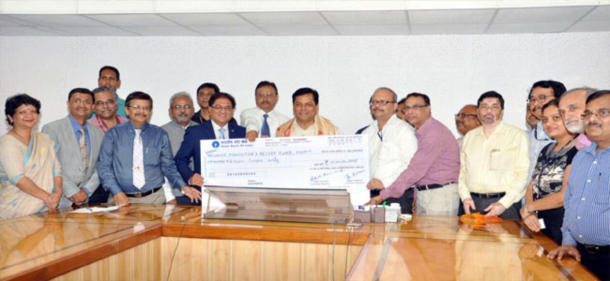 ONGC Director hands over Rupees 15 crore cheque to Assam Chief Minister