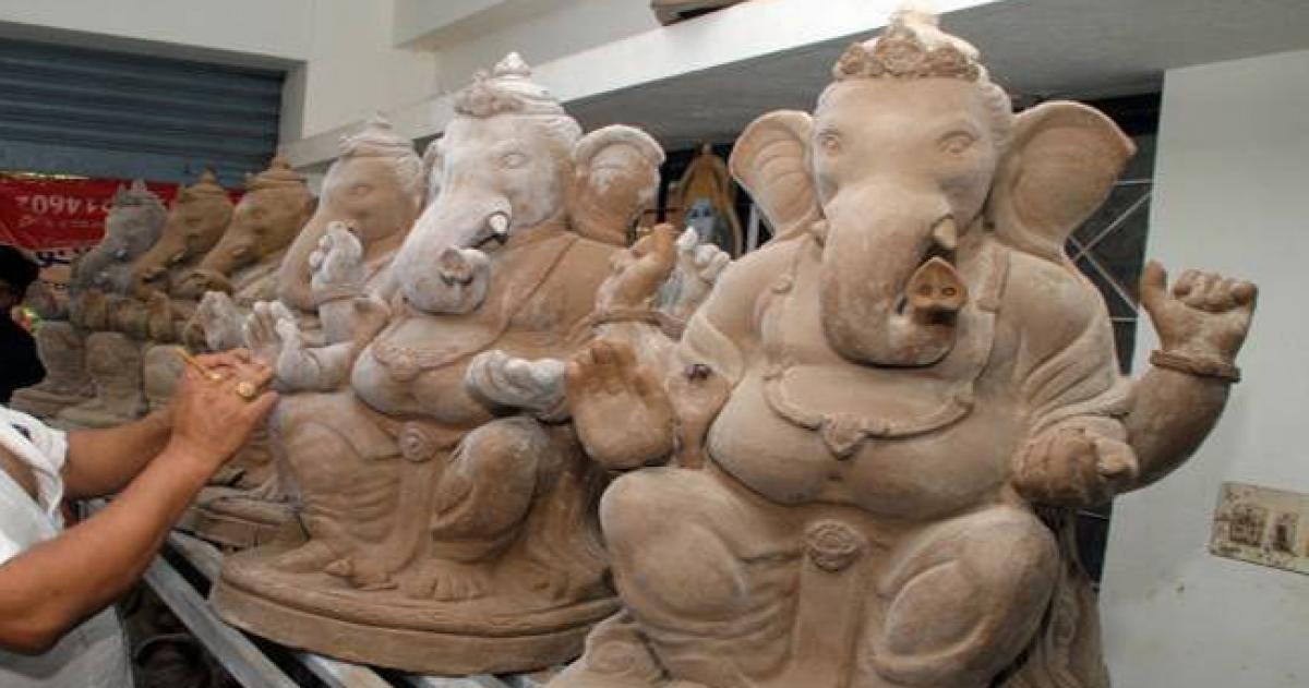 Students make clay idols of Ganesha at workshop