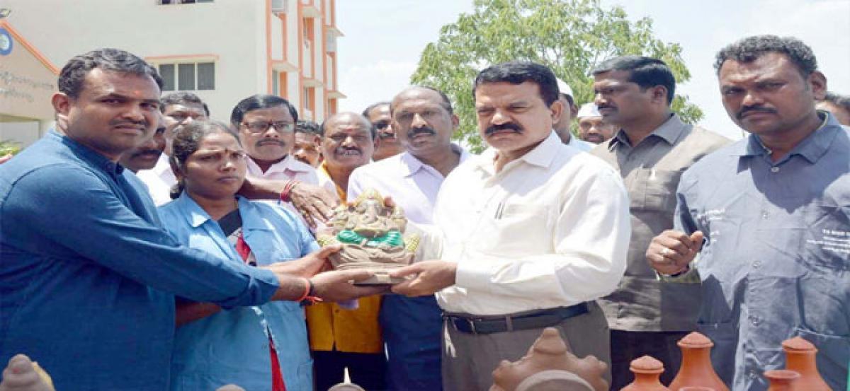 Collector MV Reddy distributes clay Ganesh idols