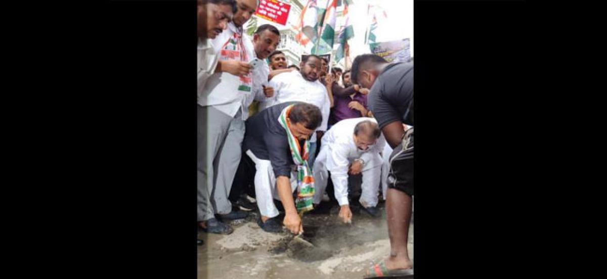 Congress fills potholes in Mumbais Bandra area, lashes out at BMC