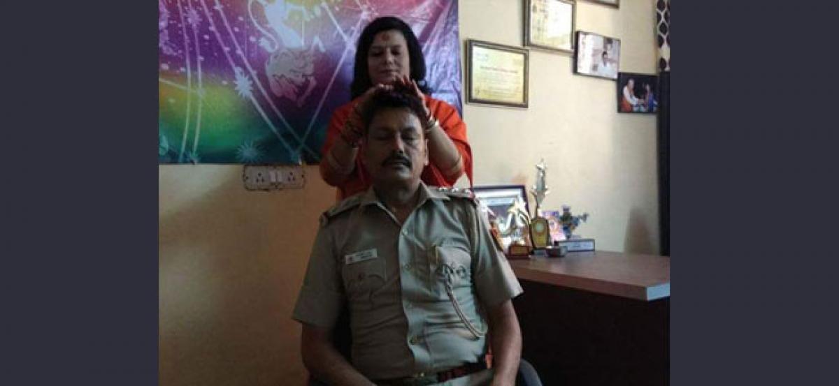 Cop transferred after picture with god woman goes viral