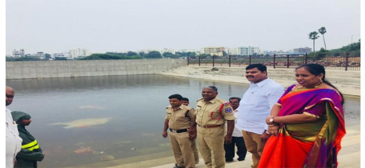 Corporator Cheruku Sangeetha inspects pond for immersion