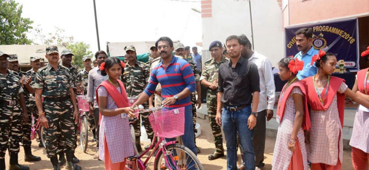 CRPF distributes bicycles to tribal girl students