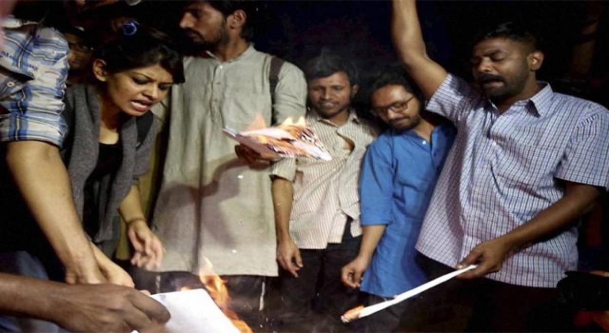 Dalit activists burn Manu Smruti copies