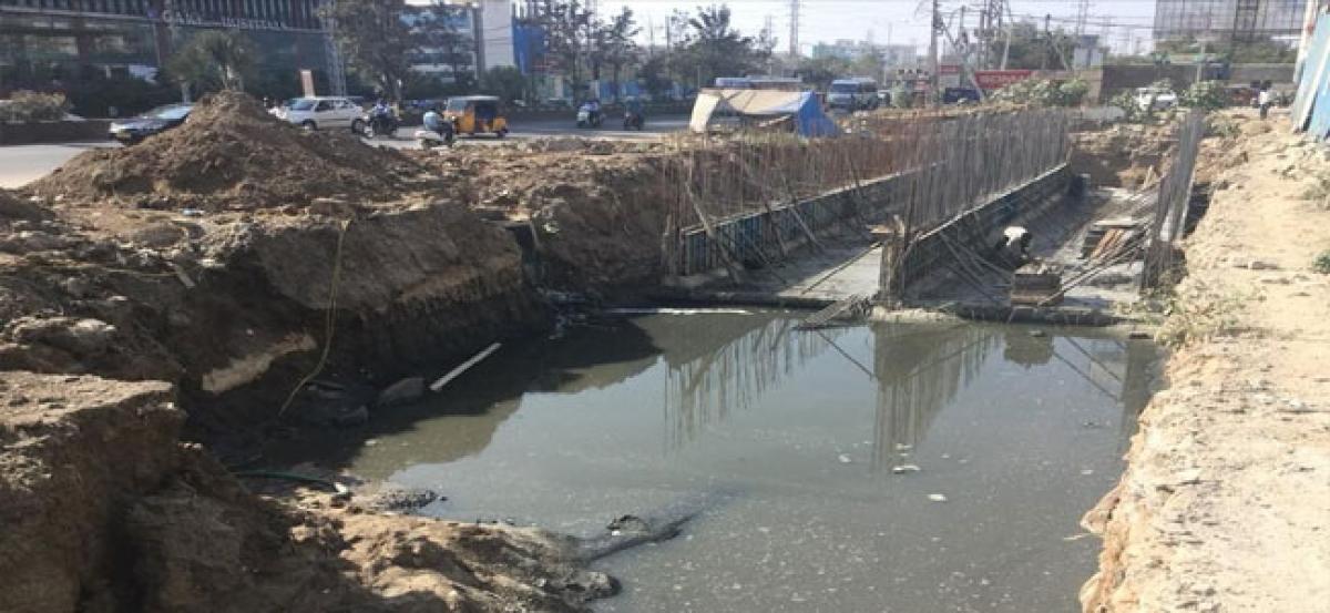 MLA Arekapudi Gandhi inspects drainage culvert