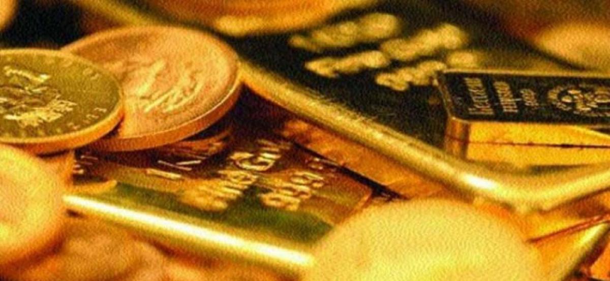 Gold remains weak on global cues, muted demand