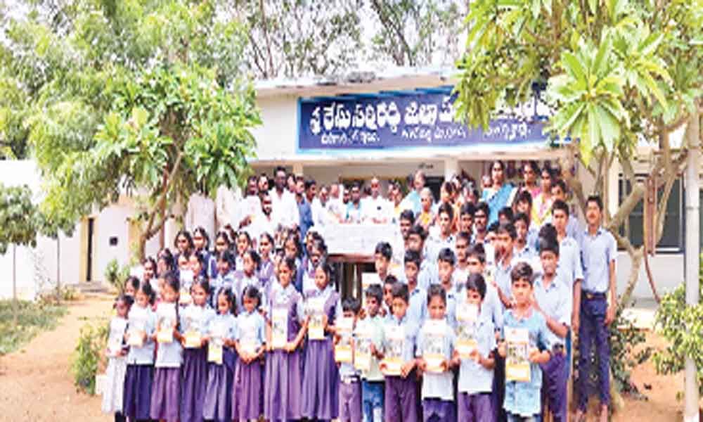 Stationery gifted to school students