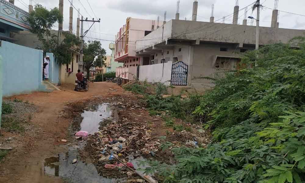 Drainage water inundates road