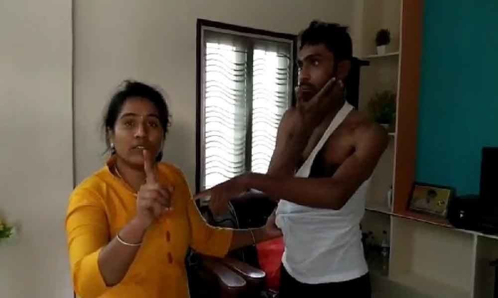 Woman catches hubby with lover, thrashes him