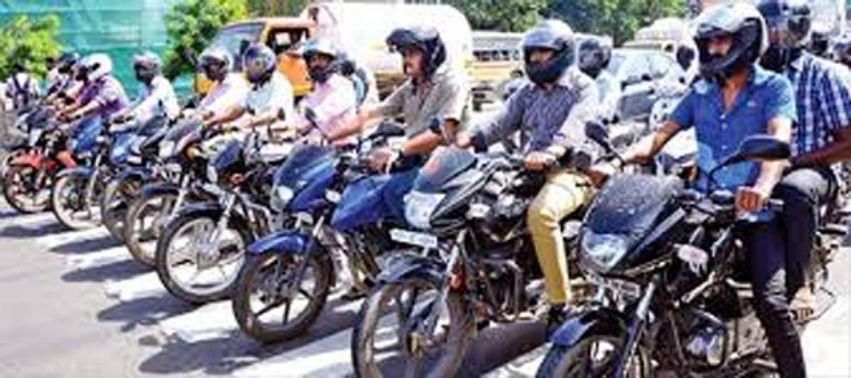 Awareness rally on wearing helmet, seat belts held