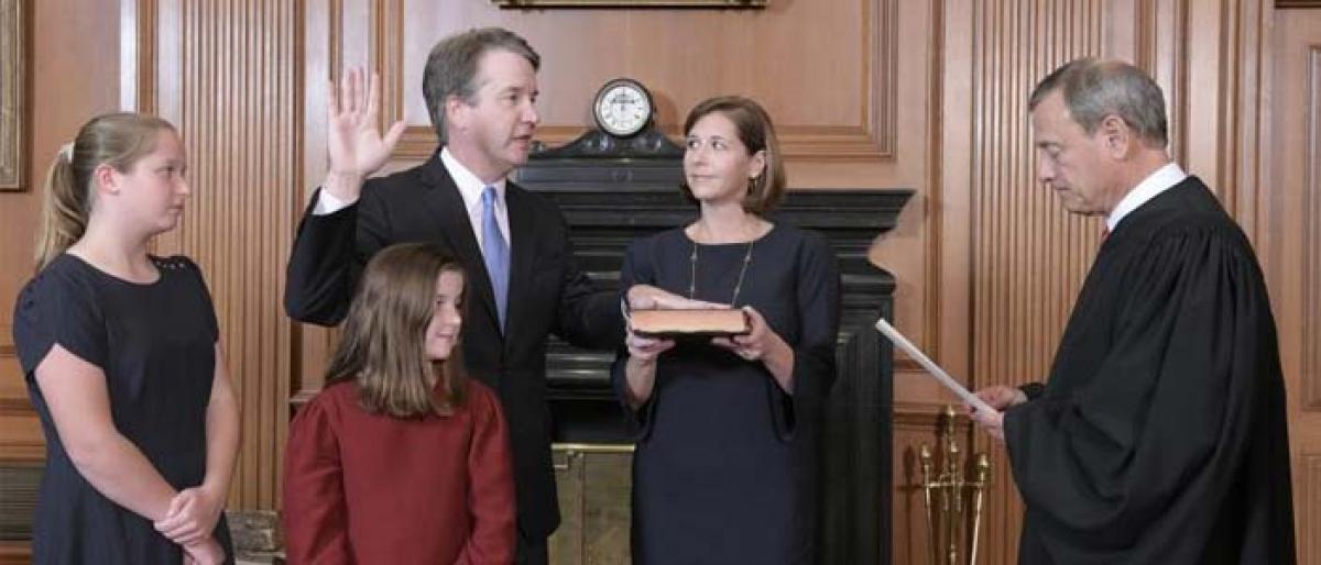 Brett Kavanaugh sworn in as US Supreme Court justice amid protests