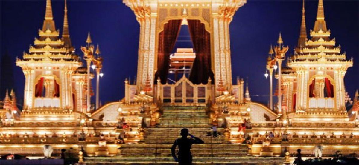 Late Thai kings remains returned to palace after night of tears