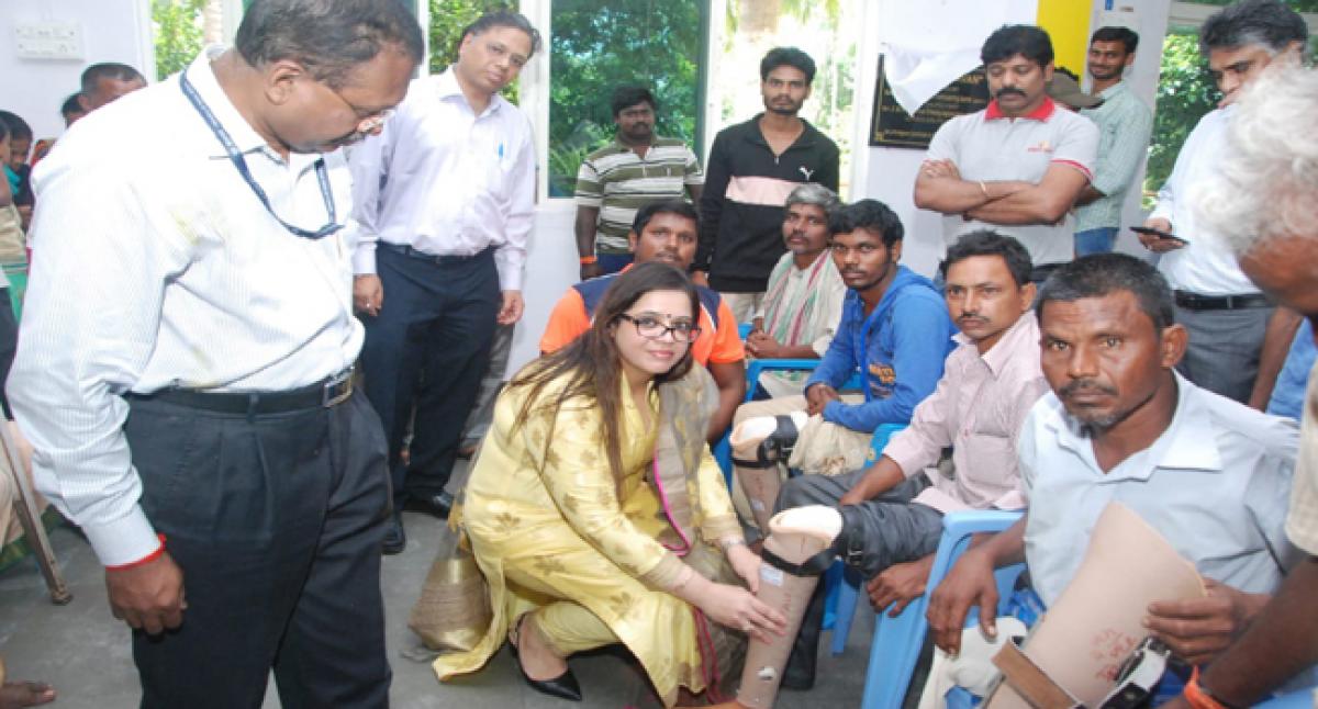 Artificial limbs, wheel chairs distributed