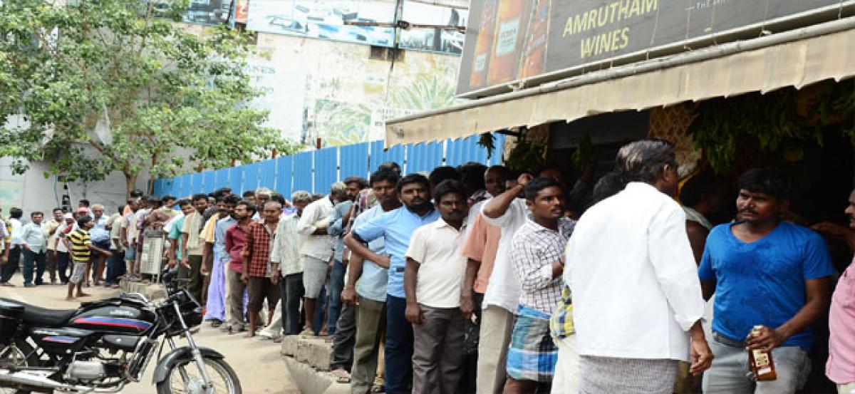 Liquor traders adopt wait and watch policy