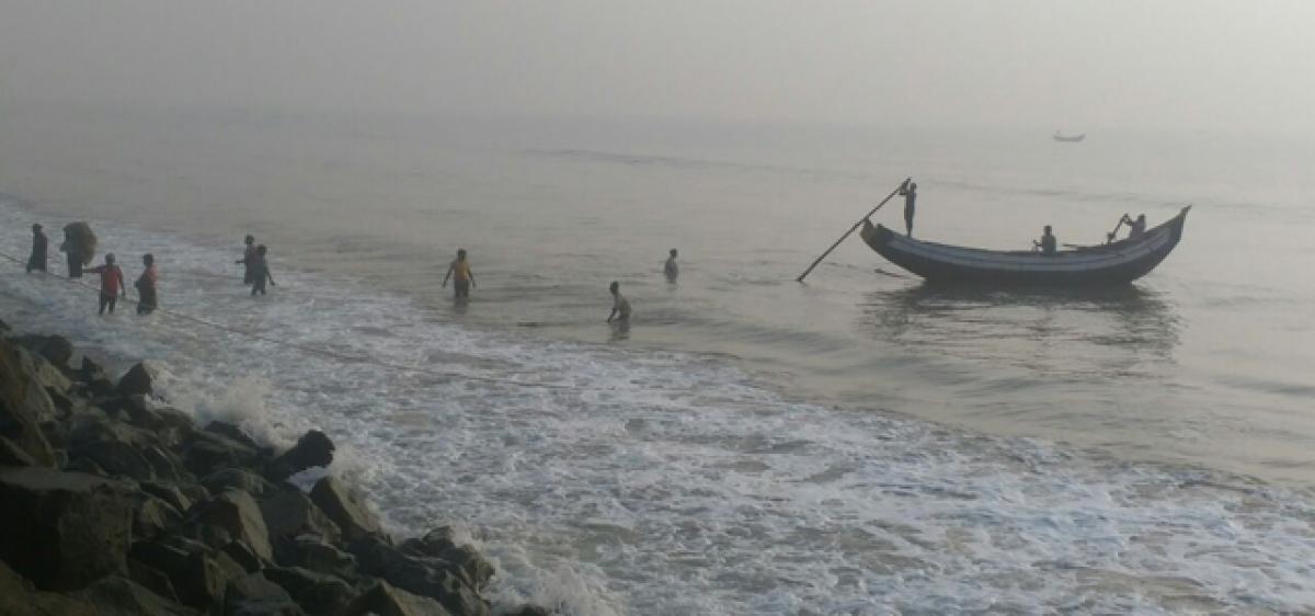 Thick fog envelops coastal villages