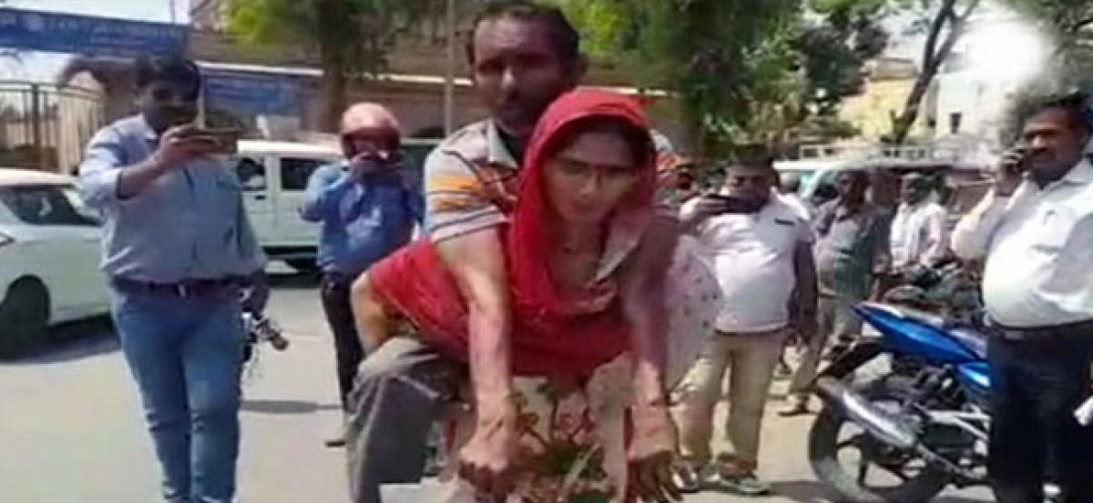 Mathura: CMO issues disability certificate after wife carries husband on back