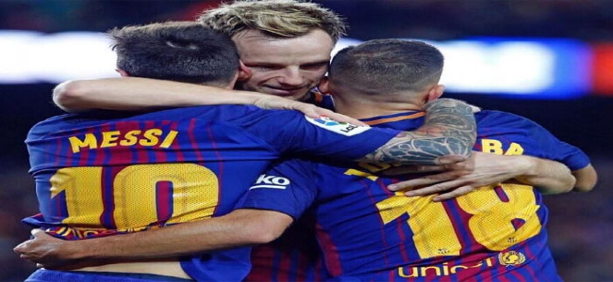 Messi treble propels Barca lead