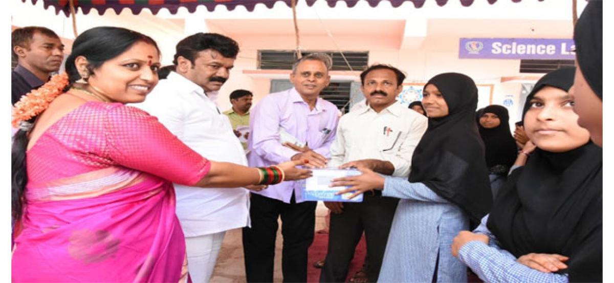 Minister Talasani Srinivas Yadav presents health kits to girl students