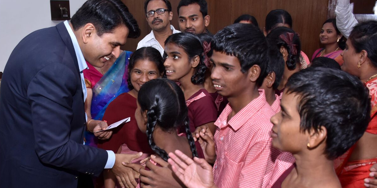 Collector interacts with differently-abled kids