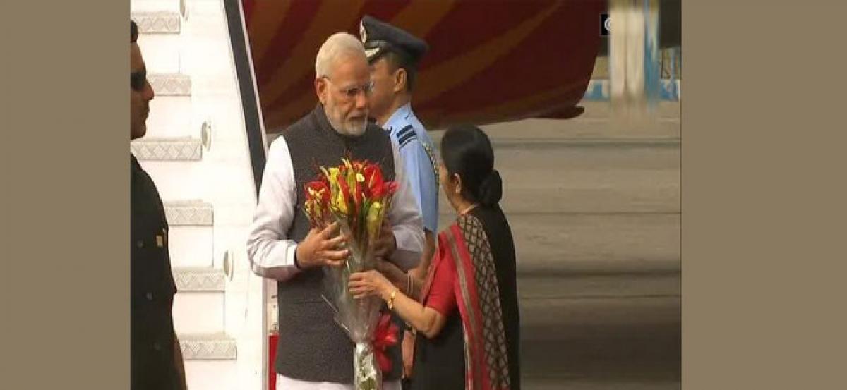 PM Modi arrives in India, received by Sushma Swaraj