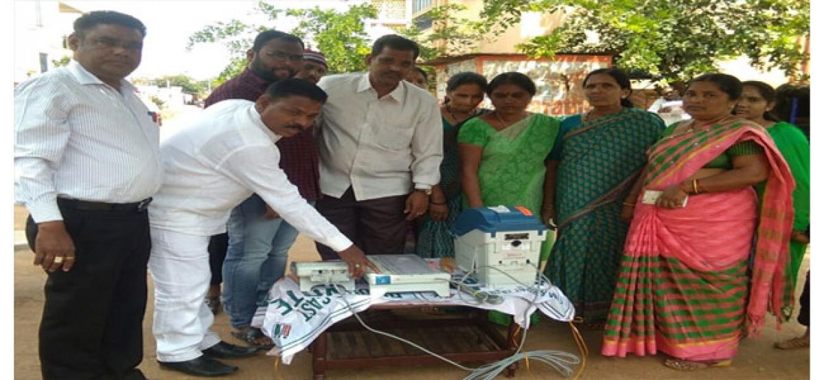 TJS candidate T Narsimulu tests EVM in mock polling