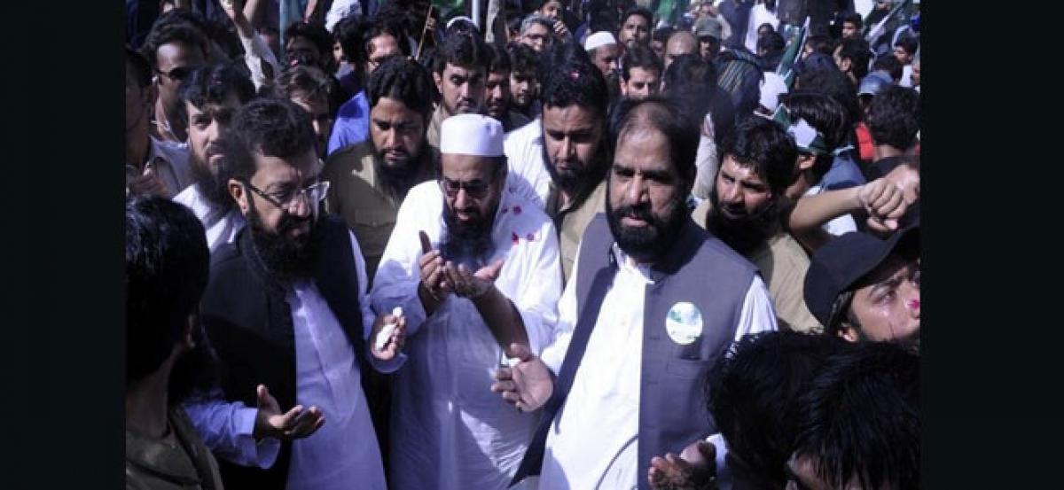 Pak elections: Terrorist Hafiz Saeed campaigns, Nawaz sits behind bars
