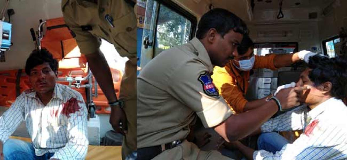 Patrolling official helps an injured man