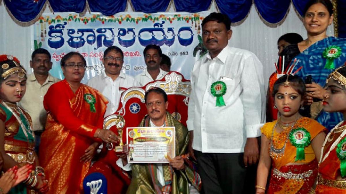 E V Srinivas Rao gets excellence award in social service