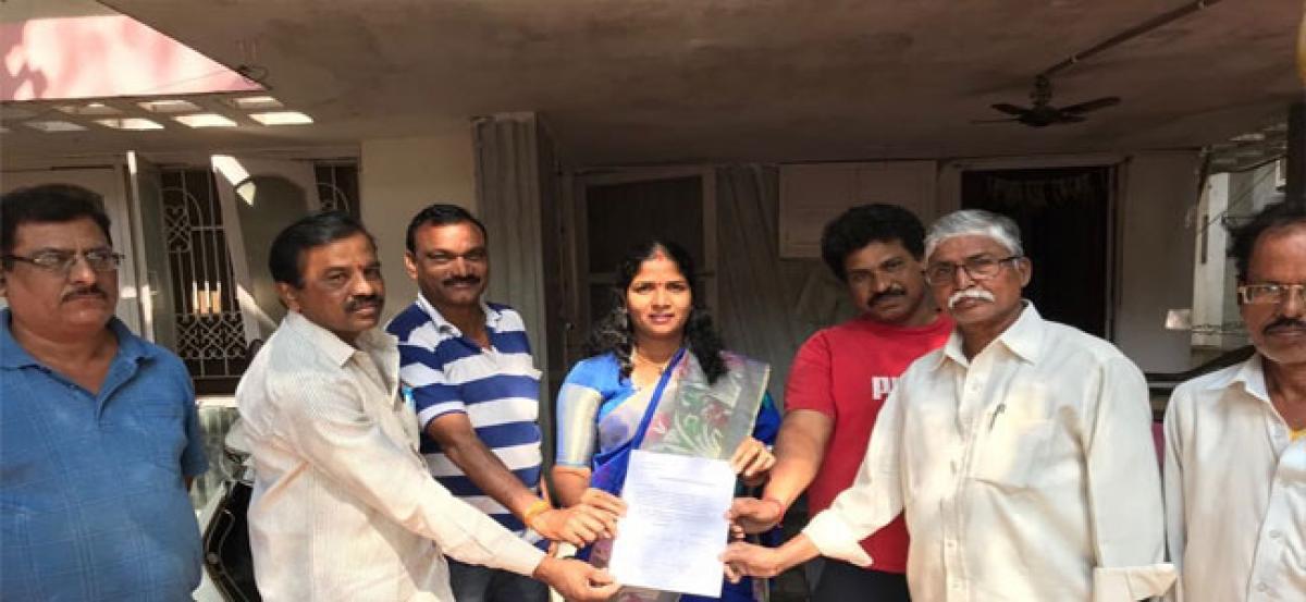 Residents of Tarnaka hand edover a letter to Corporator