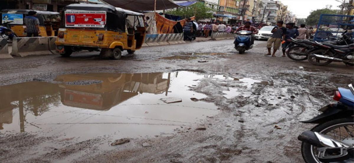 Heavy rains punch potholes on roads