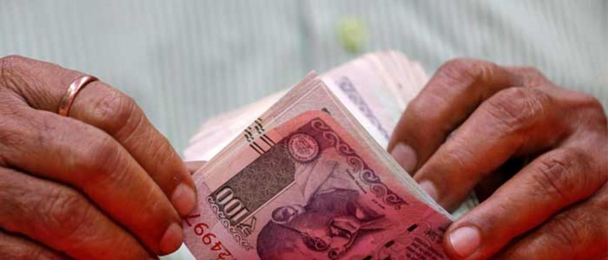 Rupee hits record low of 71 per dollar, RBI sells dollars in small amounts