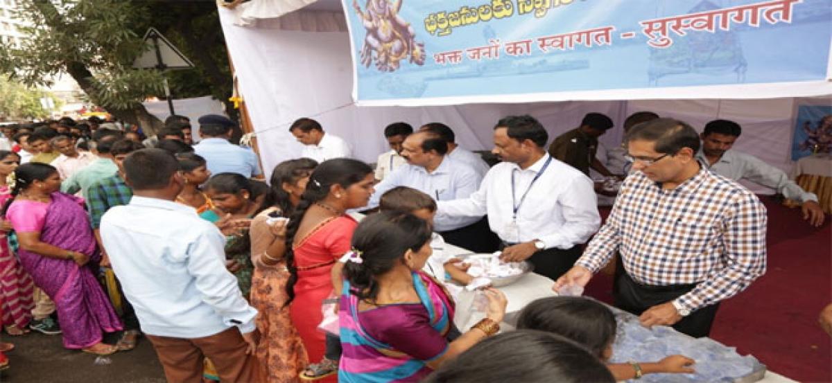 SBI distributes laddus, packed drinking water