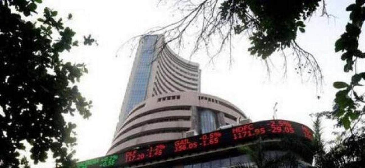 Sensex extends losses, slides 214 points on weak global cues