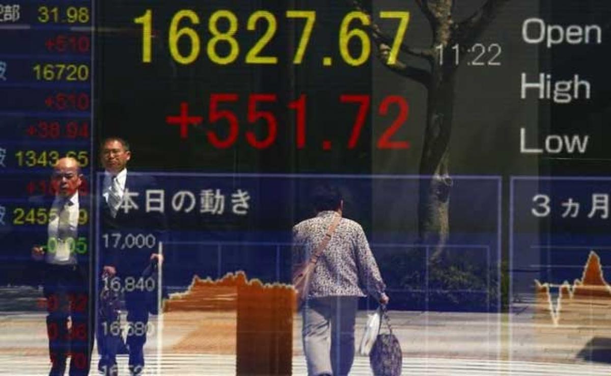 Asian shares, U.S. stock futures, dollar slip on rising Korean tensions