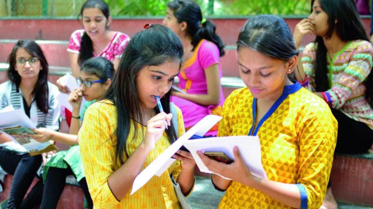 Give admission or we will jump: Girls standing atop college building threaten