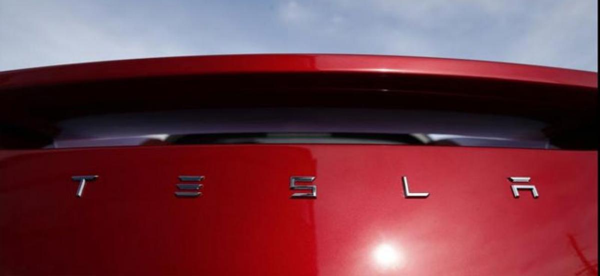Tesla shares slide after CEO Elon Musk abuses British caver