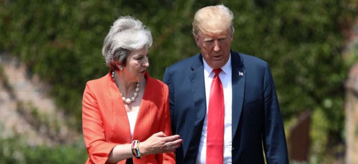 Theresa May says Donald Trump told her to sue the EU over Brexit