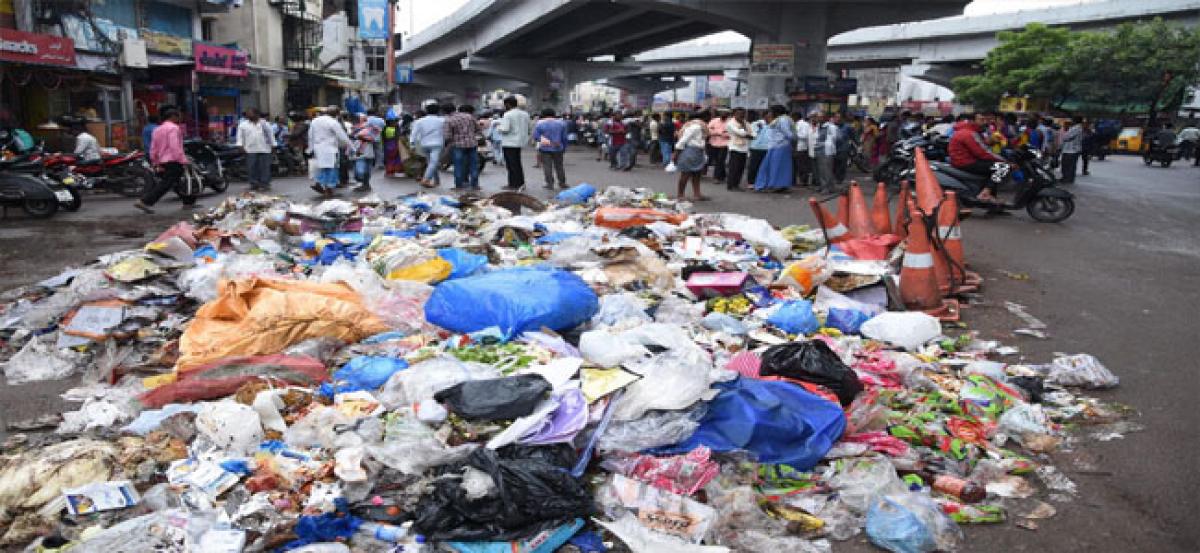 Tolichowki street vendors dump garbage on road
