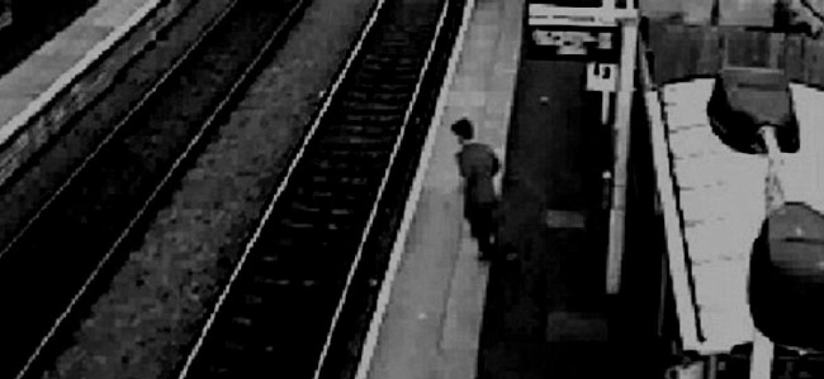 Man jumps off a moving train for his phone