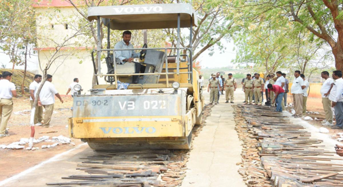 Confiscated arms crushed by road roller