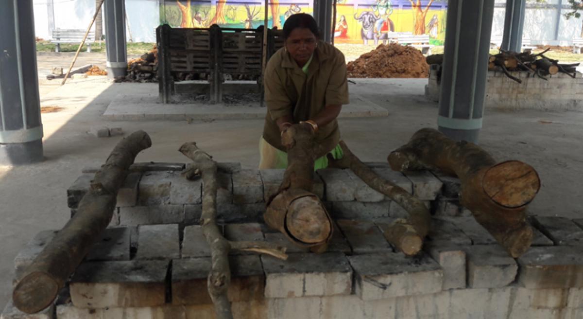 Woman caretaker at grave yard