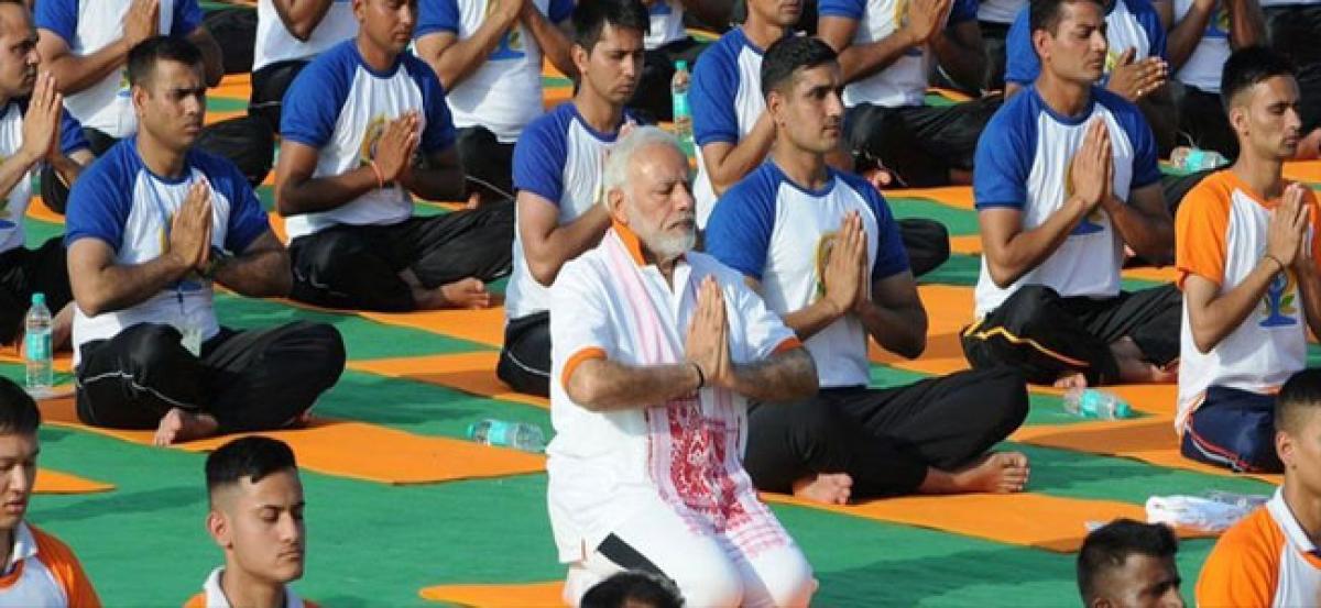 Strike a pose: International Yoga Day stretches around the world